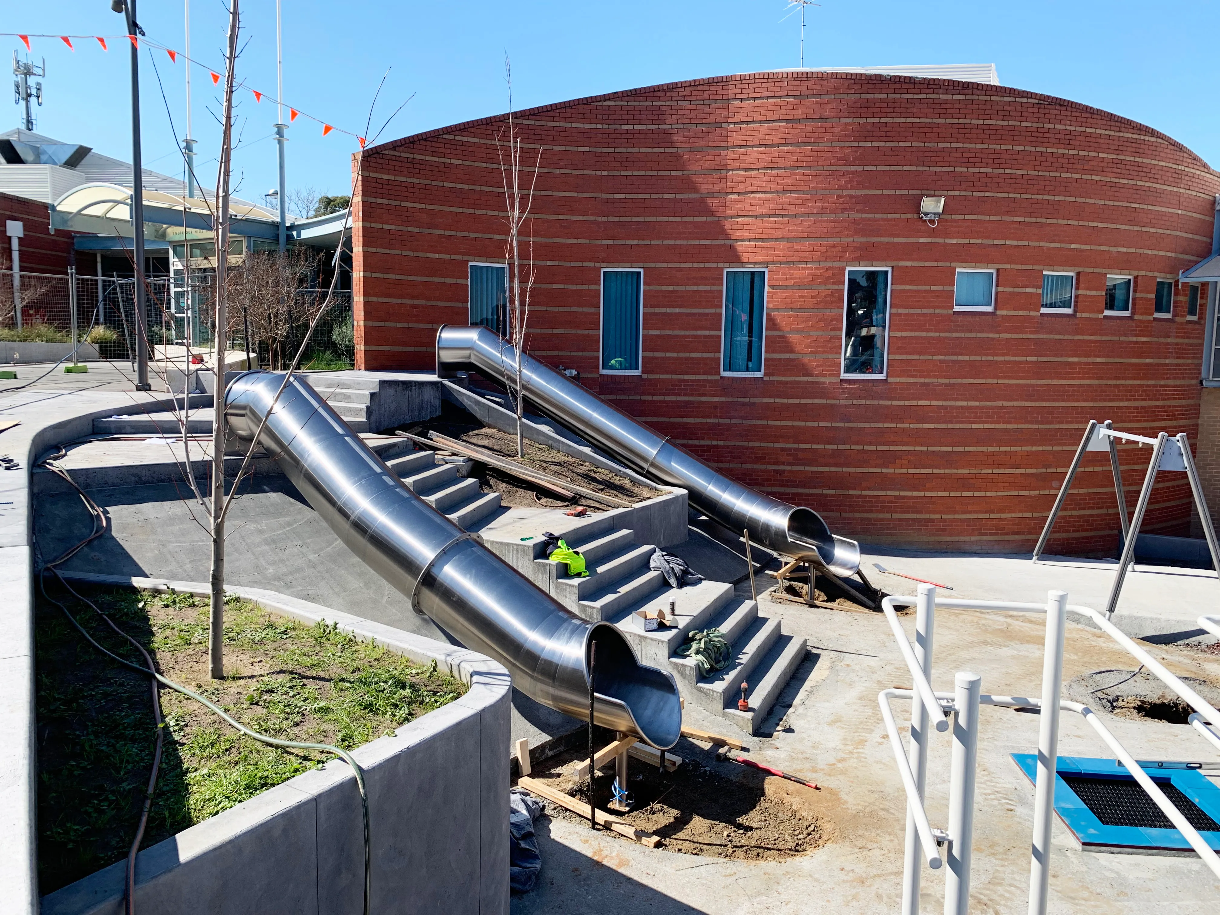 Playground with 2 stainless steel tube slides